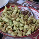 close up of a bowl full of ketupat